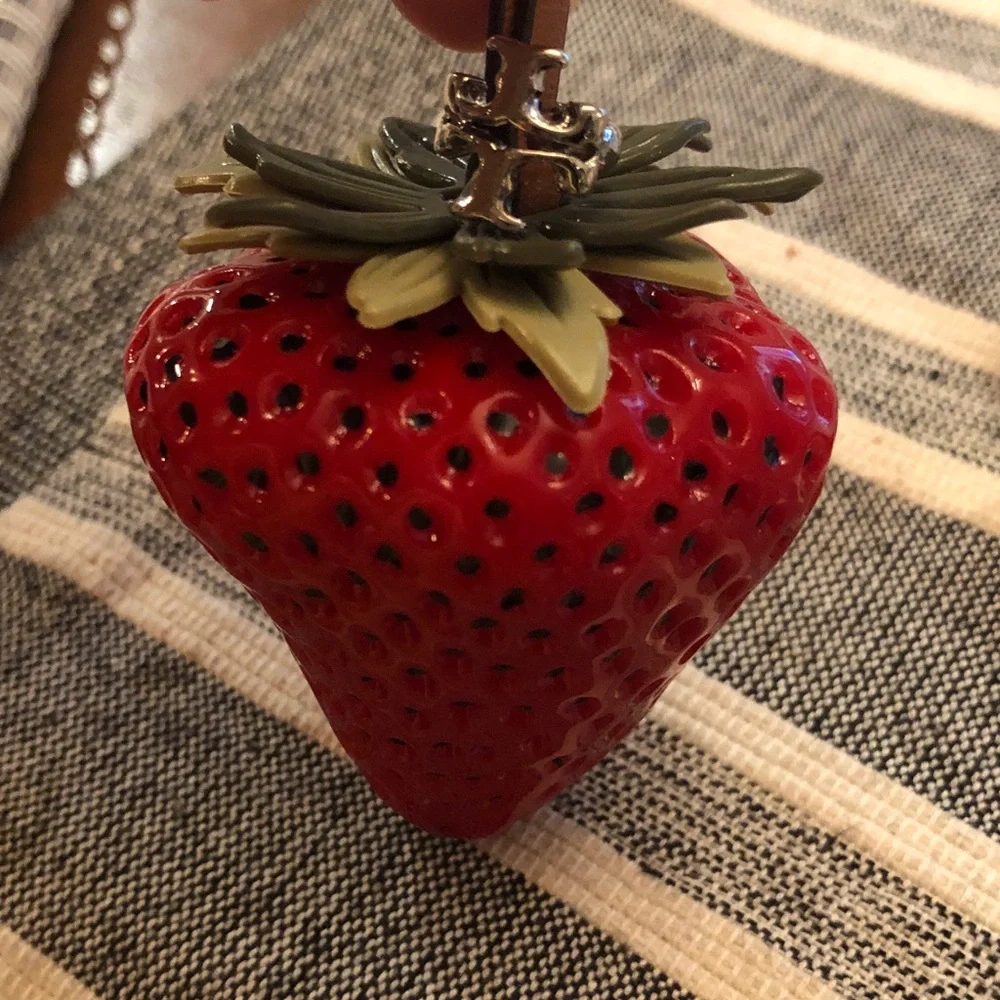 Authentic New with tag. Tory Burch Red Strawberry bag charm.
